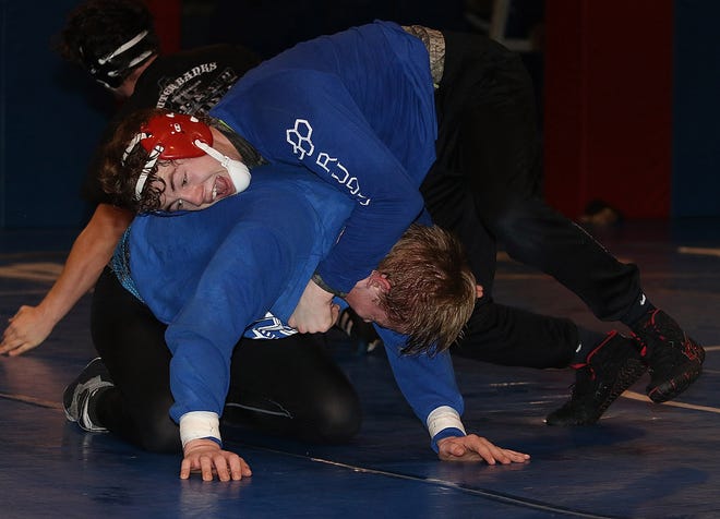 Tuslaw's Isaac Elliot, top, and Kyle Ryder , drill together at Tuslaw wrestling practice. 

(IndeOnline.com / Kevin Whitlock)