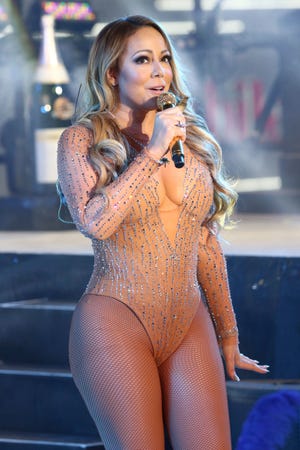FILE - In this Dec. 31, 2016, file photo, Mariah Carey performs at the New Year's Eve celebration in Times Square in New York. Carey told Entertainment Weekly in an interview published online Jan. 3, 2017, that she was was “mortified” in “real time” during the disastrous live performance in which she stumbled through several songs. (Photo by Greg Allen/Invision/AP, File)