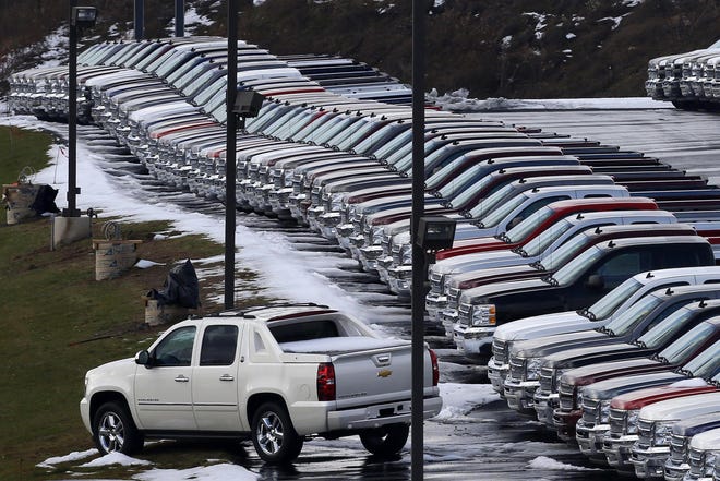 FILE - In this Wednesday, Jan. 9, 2013, file photo, Chevy trucks line the lot of a dealer in Murrysville, Pa. Demand may be slowing, but U.S. consumers still bought a whole lot of cars and trucks in 2016. U.S. sales of new vehicles could hit a new high in 2016. (AP Photo/Gene J. Puskar, File)