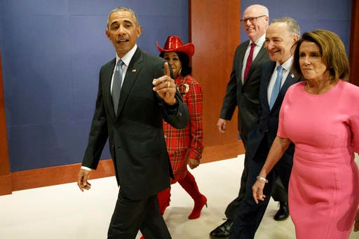 President Barack Obama, joined by, from second from left, Rep. Frederica Wilson, D-Fla., Rep. Joseph Crowley, D-N.Y., Senate Minority Leader Charles Schumer of N.Y., and House Minority Leader Nancy Pelosi of Calif. arrives on Capitol Hill in Washington, Wednesday, Jan. 4, 2017, to meet with members of Congress to discuss his signature healthcare law. (AP Photo/Evan Vucci)