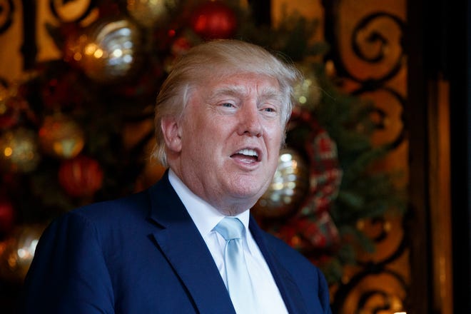 In this Dec. 28, 2016 file photo, President-elect Donald Trump speaks to reporters at Mar-a-Lago in Palm Beach, Fla. Trump is considering plans to restructure and slim down a top U.S. intelligence agency, a person familiar with the discussions said Thursday. The move comes after Trump questioned the intelligence community’s assessment that Russia interfered with the presidential election on his behalf. (AP Photo/Evan Vucci, File)