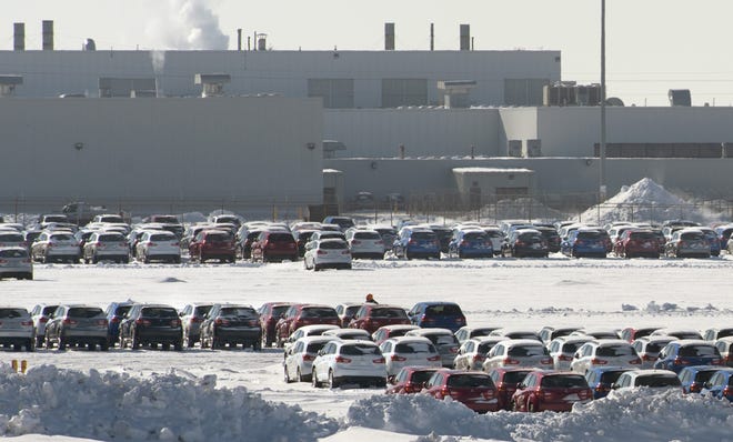 DAVID ZALAZNIK/JOURNAL STAR Vehicles stand in a lot outside of the Mitsubishi Motors plant in Normal awaiting transport in a file photo from 2015.