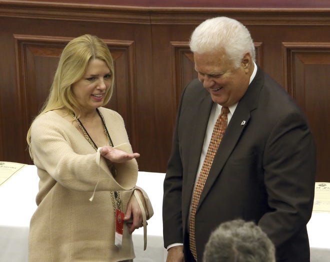 Florida attorney general and elector Pam Bondi, left, and secretary of state Ken Detzner confer before electoral members cast their presidential ballots at the state Capitol on Dec. 19. Bondi is expected to take a position in President-elect Donald Trump's Cabinet. FILE/THE ASSOCIATED PRESS