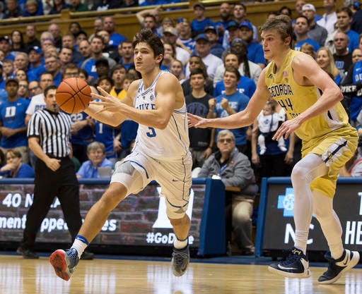 Duke's Grayson Allen, back from a team-levied suspension, drives against Georgia Tech's Ben Lammers in the first half of Wednesday night's game.
