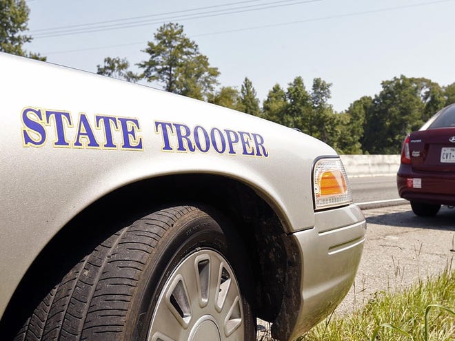Alabama State Trooper Chad Butts talks to a driver along Interstate 20/59 in Tuscaloosa County Tuesday, Aug. 5, 2014. Michelle Lepianka Carter | The Tuscaloosa News