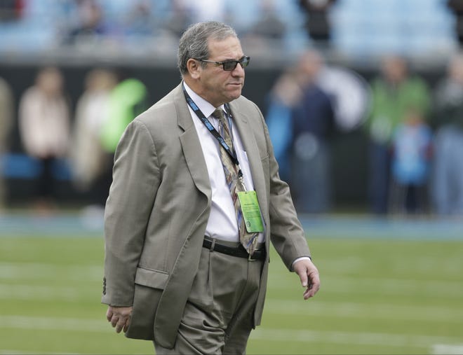 Carolina Panthers general manager Dave Gettleman watches his team warm up before an NFL football game against the Atlanta Falcons in Charlotte, N.C., Saturday, Dec. 24, 2016. (AP Photo/Bob Leverone)