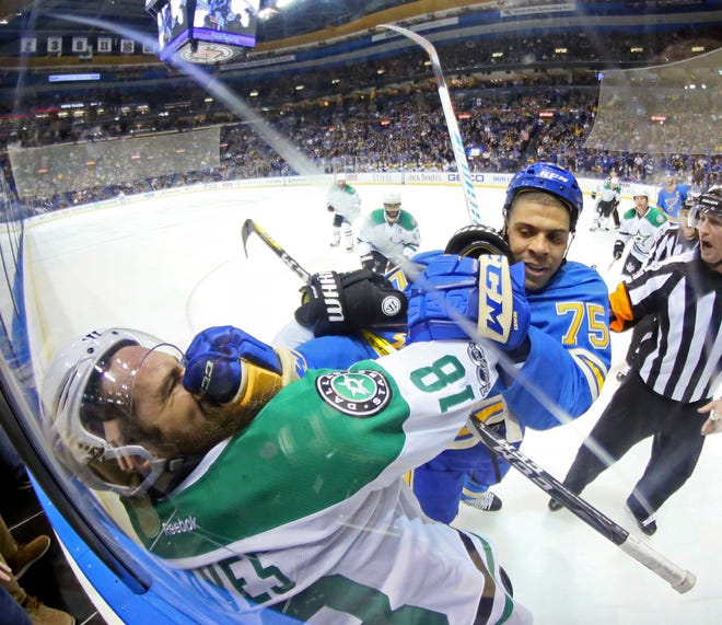 St. Louis Blues right wing Ryan Reaves tangles with Dallas Stars right wing Patrick Eaves after the whistle in the second period of an NHL hockey game Saturday, Jan. 7, 2017, in St. Louis. (Chris Lee /St. Louis Post-Dispatch via AP)