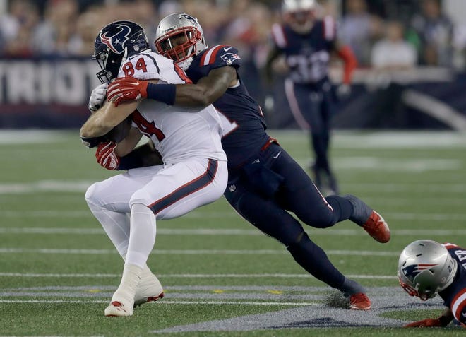 New England Patriots' Jamie Collins, right, takes down Houston Texans tight end Ryan Griffin, one of 14 tackles the linebacker posted in the game Thursday night, Sept. 23, 2016, in Foxboro.