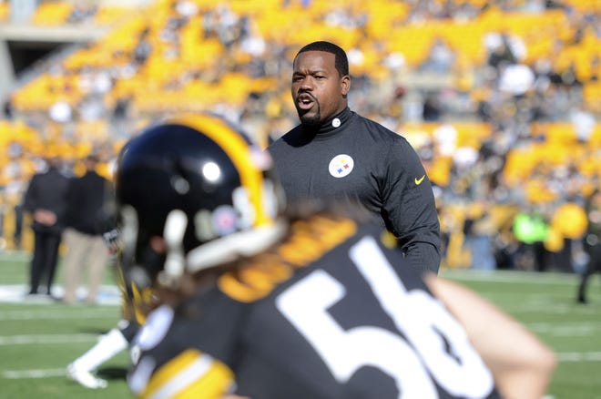 Pittsburgh Steelers linebacker coach Joey Porter was charged after an incident on the city's South Side following the team's playoff victory Sunday.