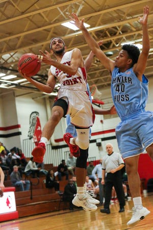 Niren Johal of South Point goes to the hoop during a game against Huss last week. The Raiders' home game against North Gaston scheduled for Tuesday has been postponed. Bill Bostick / Special to the Gazette