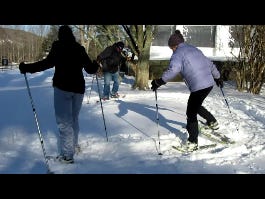 Julie Early, right, shows Karen Hines and Mike Chase some basic tips on snowshoe technique.