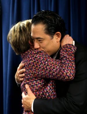 Mary Rizzo, left, mother of 19-year-old murder victim Jonathan Rizzo, hugs prosecuting attorney Dustin Chao, right, following a news conference at federal court, Monday, Jan. 9, 2017, in Boston. Gary Lee Sampson, who was convicted of killing two Massachusetts men in 2001 carjackings, was sentenced Monday, Jan. 9, 2017, to death in one of the slayings, and life in prison in the other. (AP Photo/Steven Senne)