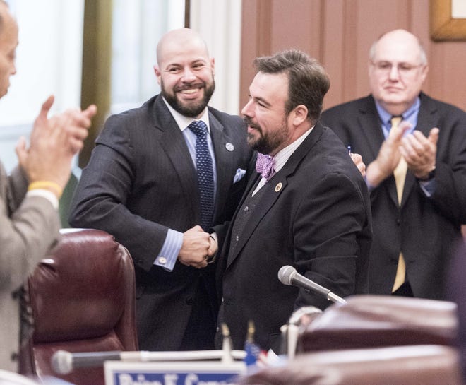 The 2017 New Bedford City Council President, Joesph P. Lopes, has a big smile on his face after the man who nominated him, Henry G. Bousquet, congratulates him. RYAN FEENEY/STANDARD-TIMES SPECIAL