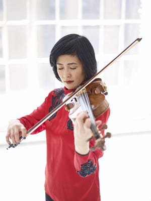 Jennifer Koh plays the violin in New York City. SPECIAL TO THE LOG