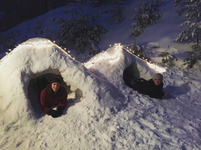 Julia (right) and her cousin Vica enjoy the snow fort they built in New Hampshire.