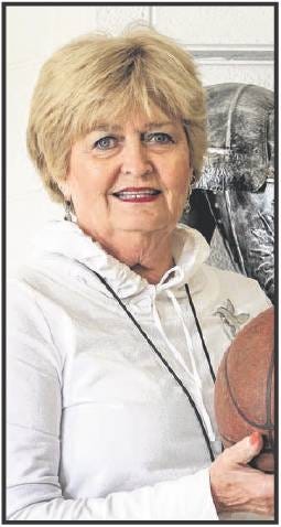 Joan Cline Backhaus poses with a basketball for a story in 2012 about the 40th-year anniversary of Title IX legislation. (Gazette file photo)