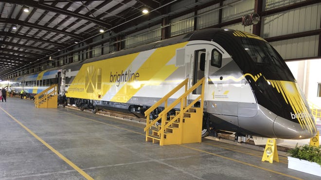 Brightline, the company building a passenger rail line between Miami and Orlando, is scheduled to show off its first engine and cars. Test runs between West Palm Beach and Miami are expected to begin soon. TERRY SPENCER/THE ASSOCIATED PRESS