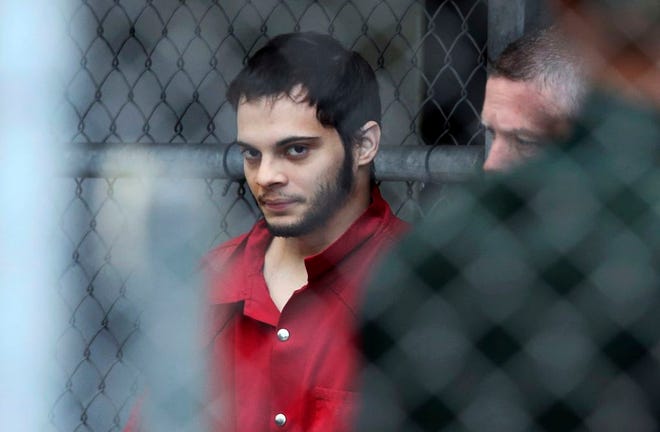 Esteban Santiago is taken from the Broward County main jail as he is transported to the federal courthouse in Fort Lauderdale on Monday. Santiago is accused of fatally shooting several people at a crowded Florida airport baggage claim and faces airport violence and firearms charges that could mean the death penalty if he's convicted.