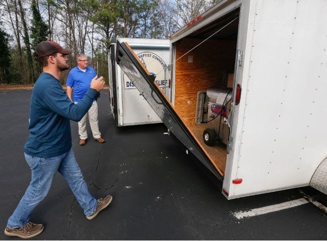 One of three stolen disaster relief trailers was returned to the Tuscaloosa County Baptist Association after they were located in Bibb County Thursday. Zach Boykin opens the rear gate on the trailer that has already been recovered. It contains industrial level cooking equipment used to feed people during disaster relief missions. Staff Photo/Gary Cosby Jr.