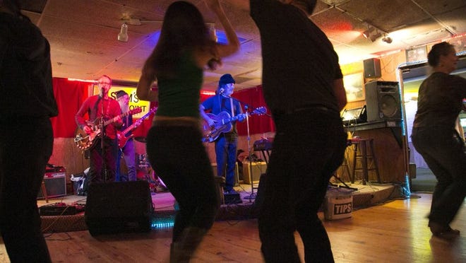 Ramsay Midwood, center, and his band play for dancers at Sam’s Town Point in South Austin. Kelly West/AMERCAN-STATESMAN