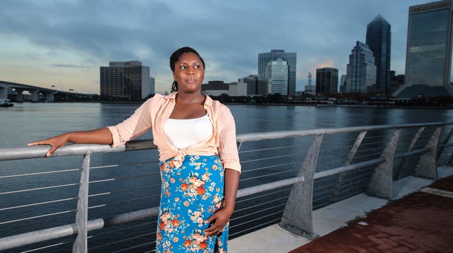 In this Thursday, Oct. 20, 2016, photo, Asia Howard poses for a photo at St. Johns River Park at sunrise, in Jacksonville, Fla. Howard was stuck in mostly retail and fast-food jobs after graduating high school, unable to get a job in banking, a profession she prized for its steady hours. After further developing her career and computer skills, she landed a job in mortgage lending that paid nearly double what she earned in previous jobs. Howard is now studying for an associate’s degree in business administration at Florida State College at Jacksonville. (AP Photo/Gary McCullough)