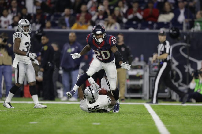 Houston Texans defensive back Don Jones (20) celebrates a play during the second half of an AFC wild-card game Saturday in Houston. (AP Photo/Eric Gay)