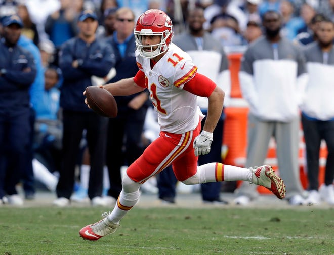 FILE - In this Sunday, Jan. 1, 2017, file photo, Kansas City Chiefs quarterback Alex Smith (11) runs during an NFL football game against the San Diego Chargers in San Diego. Smith is widely considered average when it comes to NFL quarterbacks, though that's not necessarily a bad thing. He's consistent and rarely makes mistakes. But when it comes to the playoffs, he becomes an entirely different player, bordering on elite. (AP Photo/Rick Scuteri, File)