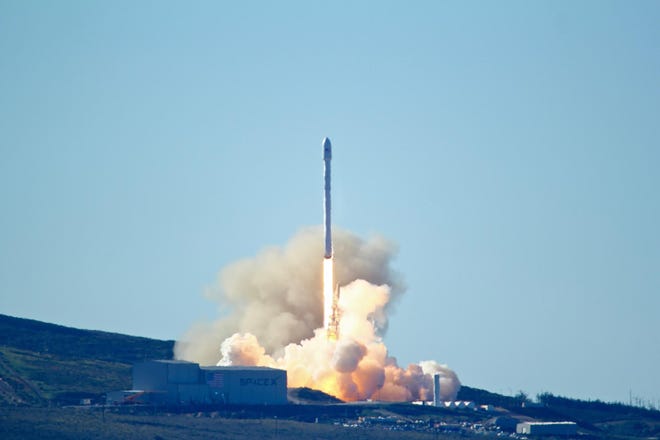 Space-X's Falcon 9 rocket with 10 satellites launches at Vandenberg Air Force Base, Calif., Saturday. MATT HARTMAN/AP