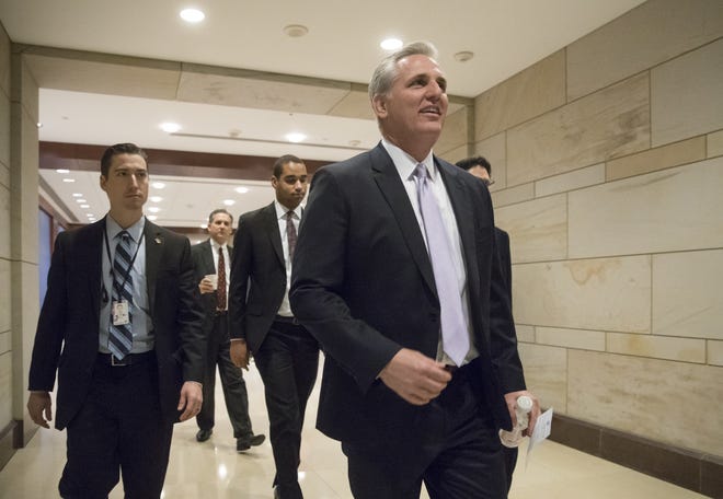 House Majority Leader Kevin McCarthy of California walks through the Capitol in Washington on Friday as members attended a closed-door intelligence briefing. Congress has approved the first step toward dismantling President Barack Obama’s health care law as Republicans pushed a budget through Congress that provides an early but crucial victory in the effort. J. SCOTT APPLEWHITE/THE ASSOCIATED PRESS