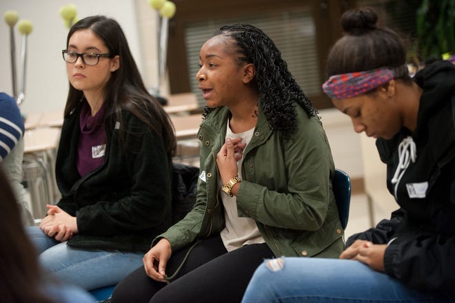 Maya Williams (center) 16, of Bristol Township, speaks to the group during a breakout discussion session at the fourth annual Teen Peace and Social Justice Summit at Central Bucks South High School in Warrington on Sunday, Jan. 15, 2017.