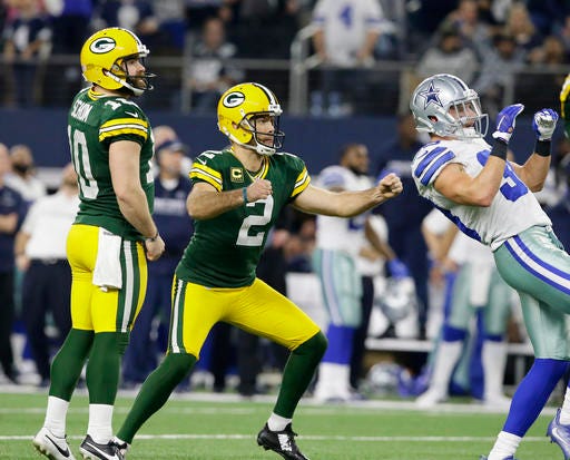 Green Bay Packers kicker Mason Crosby (2) watches his 51-yard field goal to win the game as time expires during the second half of an NFL divisional playoff football game against the Dallas Cowboys Sunday, Jan. 15, 2017, in Arlington, Texas. The Packers won 34-31. (AP Photo/LM Otero)