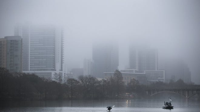Downtown Austin is hidden under a heavy fog as light rain falls on Sunday. DEBORAH CANNON/AMERICAN-STATESMAN