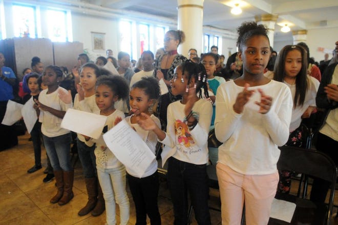Children clap during the 2nd annual Dr. Martin Luther King Jr. family event on Monday, Jan. 16, 2017 at Saint Edith Stein Church Hall.