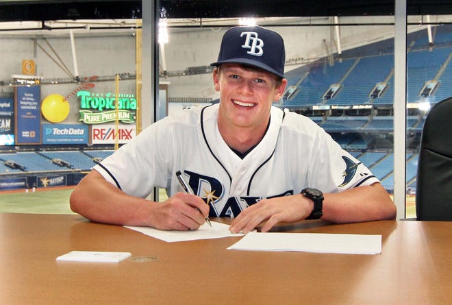 Tampa Bay Rays 2016 third-round pick Austin Franklin poses for a photo while signing his contract at Tropicana Field in St. Petersburg last June.
ERIK RUIZ/TAMPA BAY RAYS