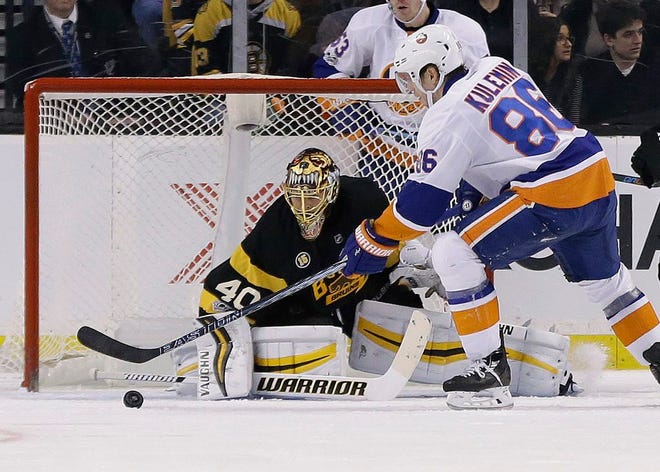 New York Islanders left wing Nikolay Kulemin scores against Boston Bruins goalie Tuukka Rask in the second period of an NHL hockey game, Monday, Jan. 16, 2017, in Boston.