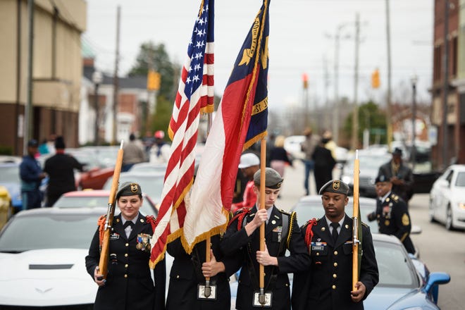 The Triton High School JROTC color guard get into position to march in the18th annual Martin Luther King Jr. parade on Monday, Jan. 16, 2017, in Dunn.