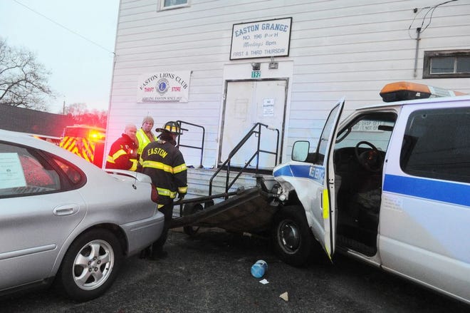 A van pushed a wooden trailer into the front steps of the old Grange Hall, which is now the home of the Easton Lions Thrift Store, Tuesday, Jan. 17, 2017.