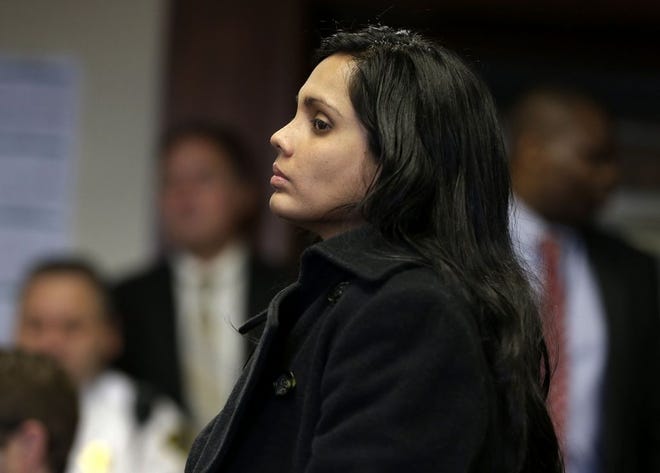 Annie Dookhan stands during her arraignment at Suffolk Superior Court, in Boston, on Dec. 20, 2012.