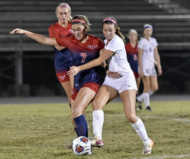 Manatee's Mckenna Strickler (7) battles for the ball against Riverview's Sofia Genta (8) Wednesday at Riverview High School's Ram Bowl on Wednesday. HERALD-TRIBUNE STAFF PHOTO / THOMAS BENDER