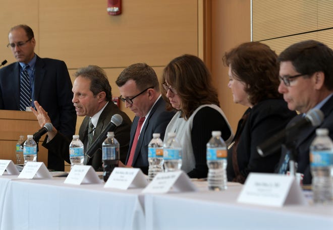 Dr. Jay Himmelstein, second from left, speaks at a panel discussion Wednesday at the University of Massachusetts Medical School in Worcestser on the repeal of the Affordable Care Act. Dr. Himmelstein, is chief federal strategist for Commonwealth Medicine, a division of UMass Medical School. T&G Staff/Christine Peterson