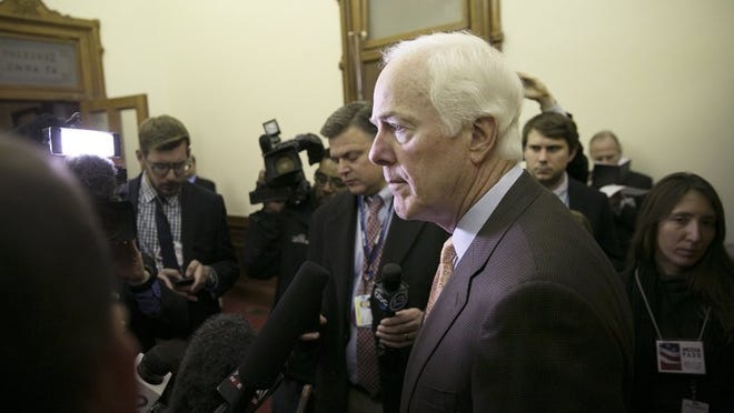 U.S. Sen. John Cornyn speaks to reporters before the Electoral College vote at the Texas Capitol on Dec. 19.