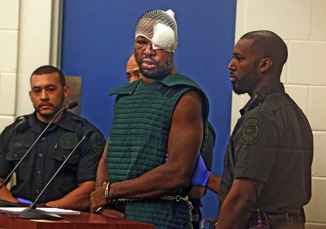 Markeith Loyd, suspected of fatally shooting a Florida police officer, attends his initial court appearance Thursday, Jan. 19, 2017, at the Orange County Jail, in Orlando, Fla. Loyd spoke out of turn and was defiant during the appearance on charges of killing his pregnant ex-girlfriend. He was injured during his arrest Tuesday night following a weeklong manhunt.