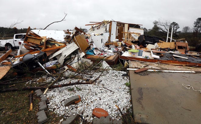Virtually nothing remains of the home of Jessie and Diana Mills of Magee, Miss., following a direct hit by a possible morning tornado on Thursday. (AP Photo/Rogelio V. Solis)