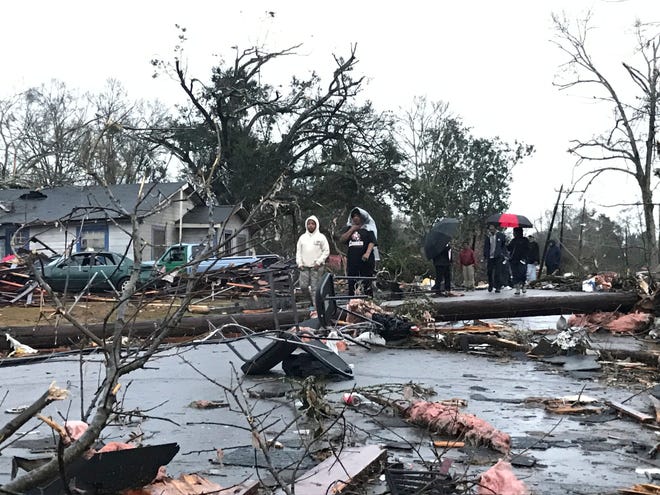 Trees and debris cover the ground after a tornado tornado ripped through the Hattiesburg, Miss., area early Saturday, Jan. 21, 2017. Mayor Johnny DuPree has signed an emergency declaration for the city, which reported “significant injuries” and structural damage. (Ryan Moore/WDAM-TV via AP)