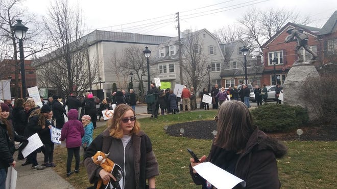Protesters organize for a silent protest in Courthouse Square in Stroudsburg. (Pocono Record photo)