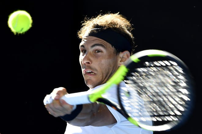 Spain's Rafael Nadal makes a forehand return to Germany's Alexander Zverev during their third round match at the Australian Open tennis championships in Melbourne, Australia, Saturday. THE ASSOCIATED PRESS / ANDY BROWNBILL