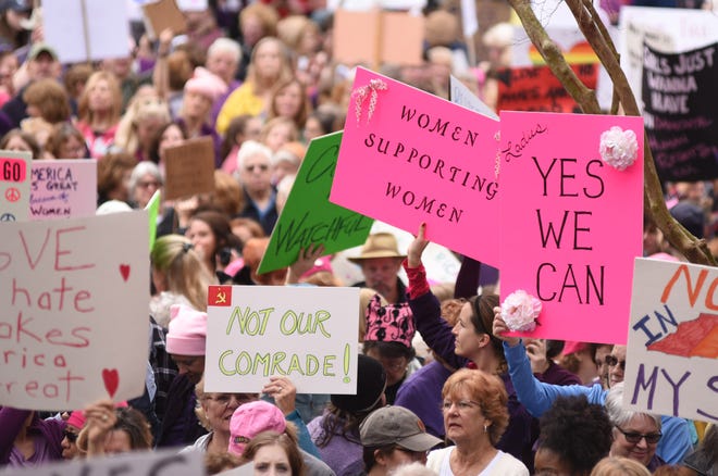Well over a thousand people gathered to listen to speakers and demonstrate at the Wilmington Women's March near Wilmington City Hall on Saturday morning. MATT BORN/STARNEWS