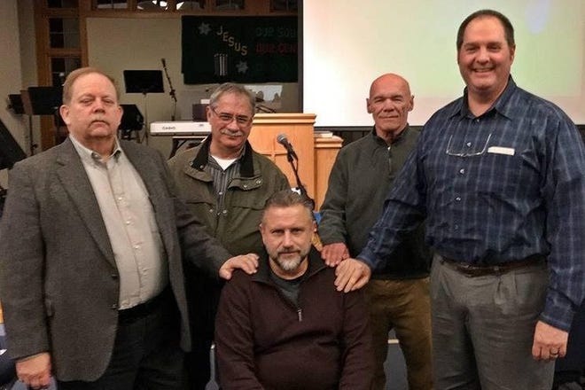 Ordained as an elder at Dartmouth Bible Church is Glen Parker (sitting) of Acushnet to serve with incumbent elders (left to right) Rev. Dr. Neil Damgaard (pastor), Donald Clapp, William Hallett Jr. and Steuart Bailey Jr. SUBMITTED PHOTO