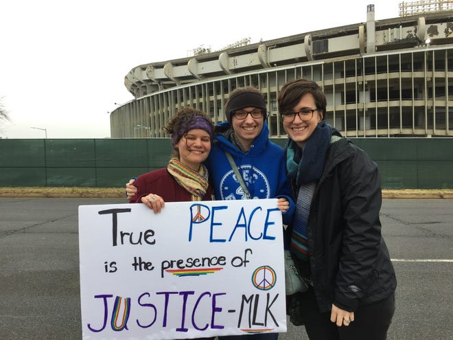 Sydney (center) enjoys the Women's March on Washington Saturday with Kate Whitman (left), who works at the Bucks County Peace Center, and Erin Miller-Batenburg, an Arcadia intern working with the Peace Center in peace and conflict resolution.