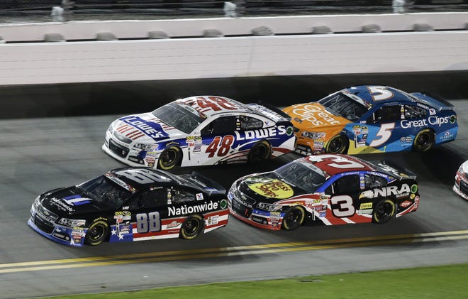 Dale Earnhardt Jr. (88) leads Jimmie Johnson (48), Austin Dillon (3) and Kasey Kahne (5) on a restart after a caution in a NASCAR Sprint Cup series auto race at Daytona International Speedway on July 6, 2015, in Daytona Beach. AP FILE